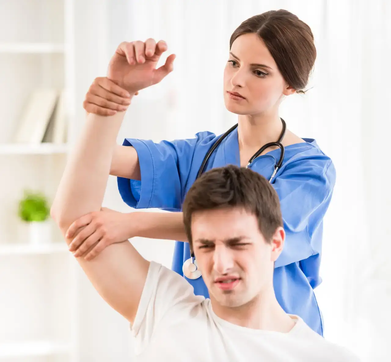 physiotherapist massaging hand
